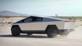 Tesla-Cybertruck-Electric-Pickup-Truck-Rear-3-4-in-Motion.webp