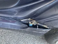 Genny left rocker panel damage.webp